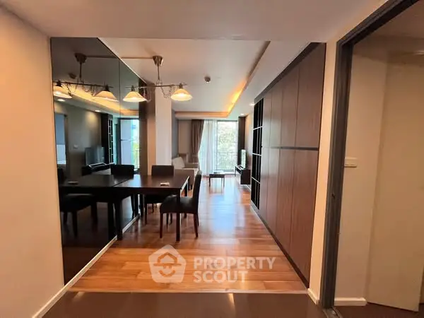 Spacious modern living room with dining area and wooden flooring