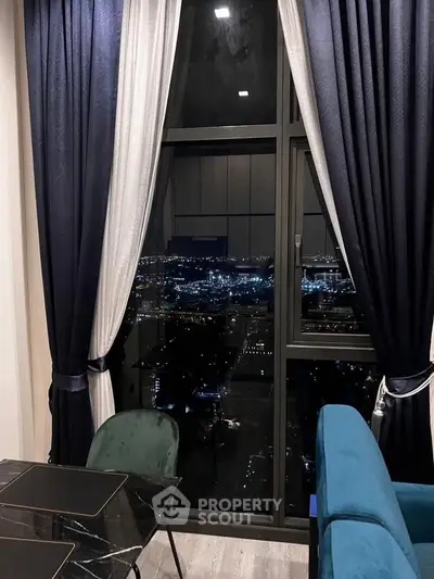 Luxurious high-rise apartment with stunning city night view from large window