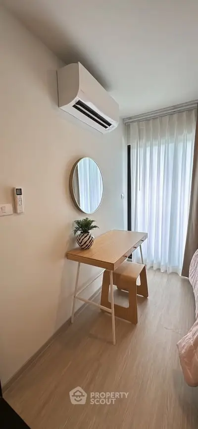 Cozy bedroom corner with modern air conditioning and stylish wooden desk