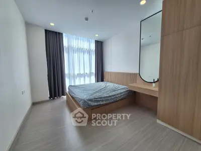 Modern minimalist bedroom with large window and stylish wood accents