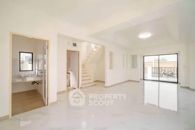 Spacious open-plan living area with modern design and abundant natural light.