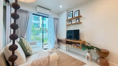 Modern living room with stylish decor, large window, and garden view in a contemporary apartment.