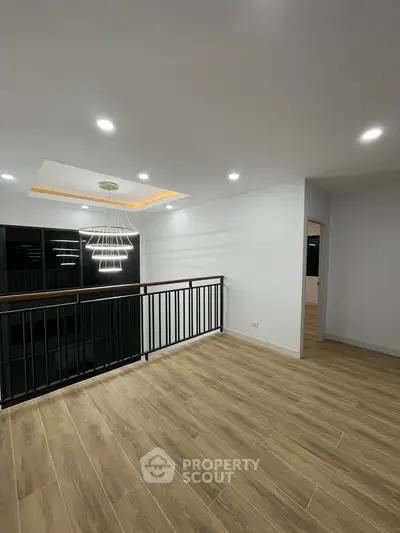 Modern interior with elegant lighting and wooden flooring, perfect for a stylish living space.