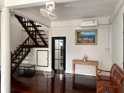 Charming interior with wooden staircase and elegant decor in a cozy living space