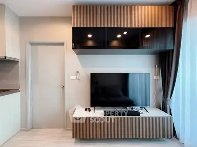 Modern living room with sleek TV unit and elegant lighting