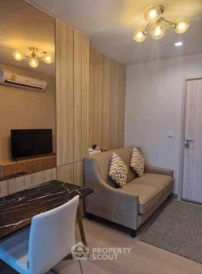 Modern living room with stylish lighting and cozy sofa in a chic apartment.