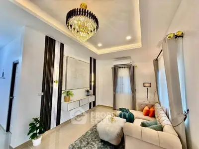 Luxurious living room with elegant chandelier and modern decor, perfect for stylish living.