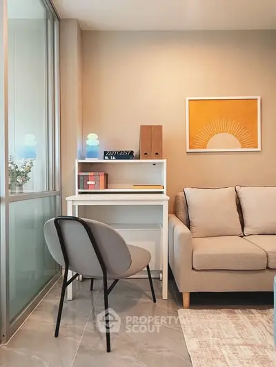 Modern living room with cozy sofa and stylish study nook, perfect for urban living.