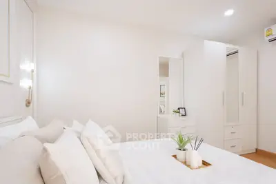 Elegant bedroom with modern decor and ample storage space
