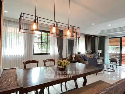 Spacious modern living room with elegant dining area and large windows