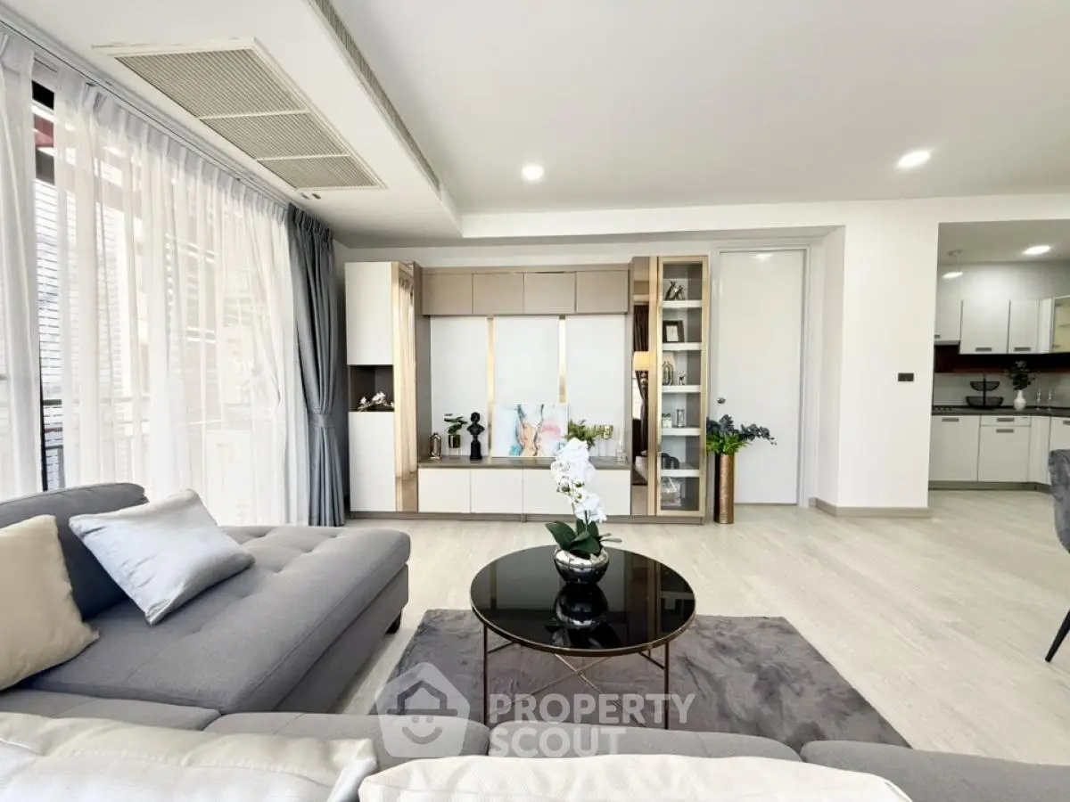 Spacious modern living room with elegant decor and natural light