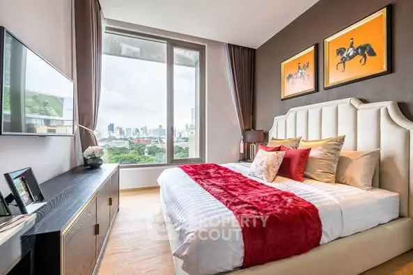Luxurious bedroom with city view, elegant decor, and modern furnishings.