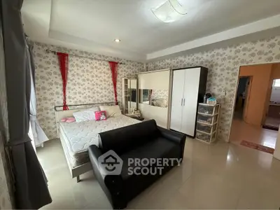 Spacious bedroom with modern decor and ample storage