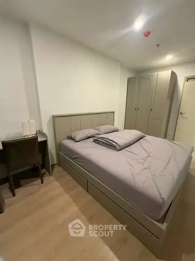 Modern bedroom with sleek furniture and cozy ambiance