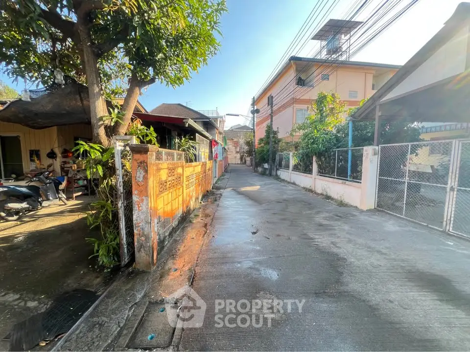 Charming residential street with lush greenery and cozy homes, perfect for tranquil living.