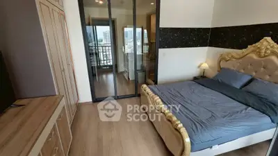 Luxurious bedroom with elegant decor and city view balcony in modern apartment
