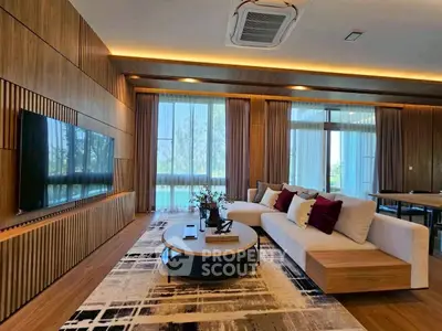 Luxurious modern living room with elegant wooden paneling and large windows offering stunning views.
