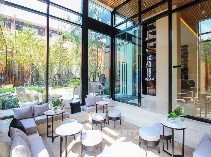 Luxurious modern living room with floor-to-ceiling windows and garden view