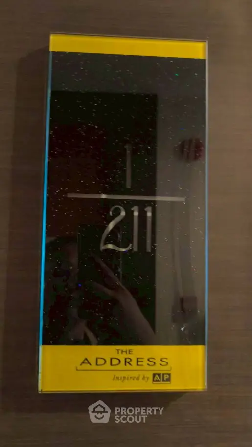 Stylish modern apartment number plaque at The Address by AP.