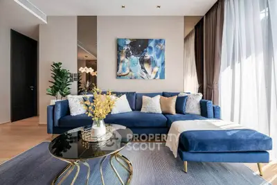 Luxurious living room with blue velvet sofa and modern decor