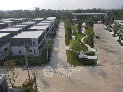 Modern residential complex with green spaces and playground