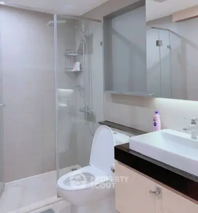 Modern bathroom with glass shower and sleek fixtures