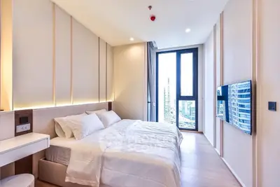 Luxurious modern bedroom with city view and sleek design