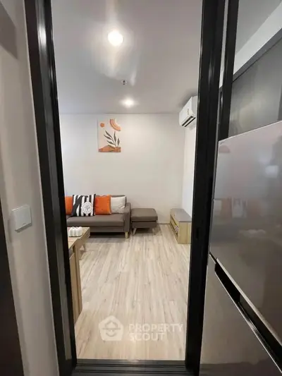 Modern living room with stylish decor and cozy seating area, perfect for relaxation and entertainment.
