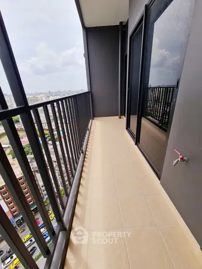 Spacious balcony with city view, perfect for relaxation and enjoying the skyline.