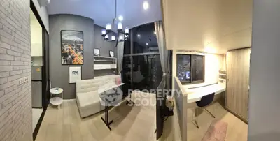 Modern living room with stylish decor and city view, featuring a cozy study nook.