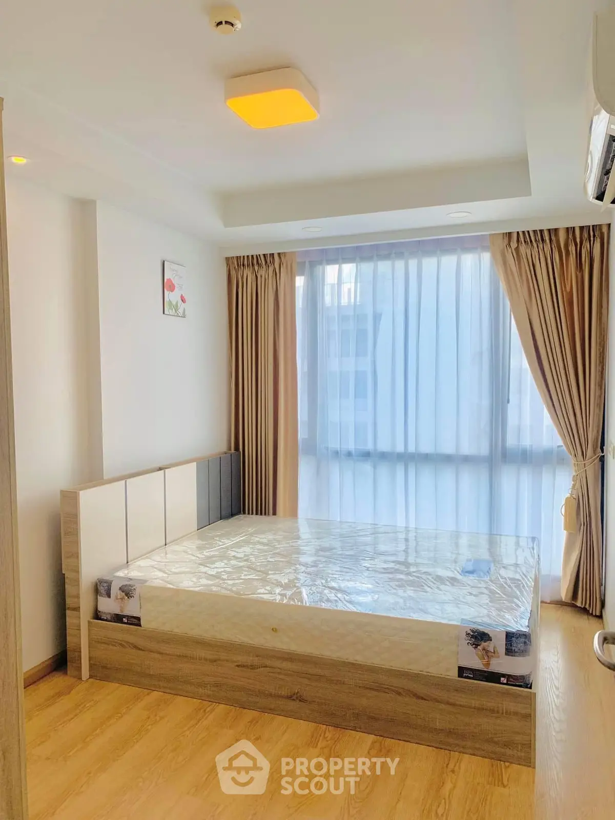 Bright and modern bedroom with large window and stylish decor