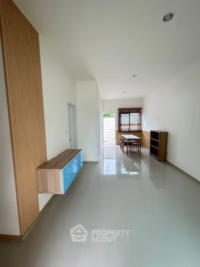 Spacious modern living area with sleek design and natural light