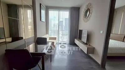 Modern living room with sleek furniture and city view, perfect for urban living.