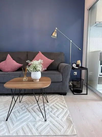 Stylish living room with modern sofa, chic coffee table, and elegant decor accents.