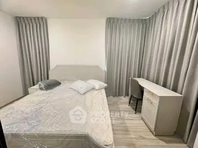 Cozy bedroom with modern furnishings and natural light