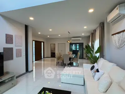 Spacious modern living room with elegant decor and ample natural light