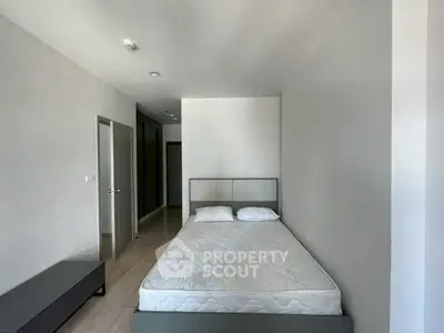 Spacious bedroom with minimalist design and natural light