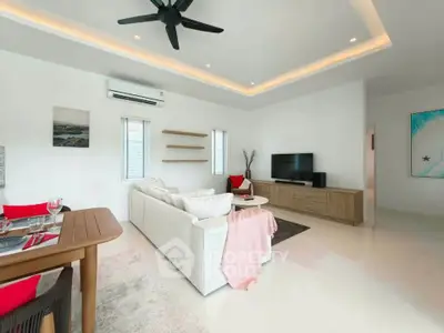 Spacious modern living room with elegant decor and natural light