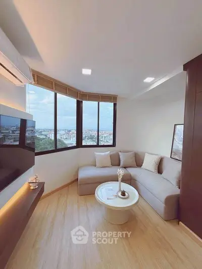 Modern living room with panoramic city view and stylish decor