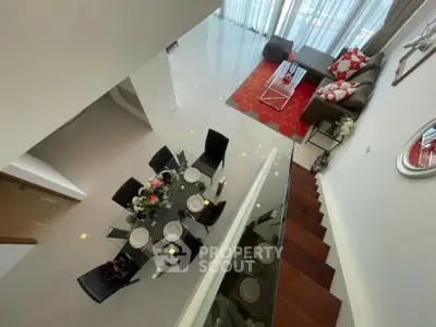 Modern duplex living room with elegant dining area and stylish decor