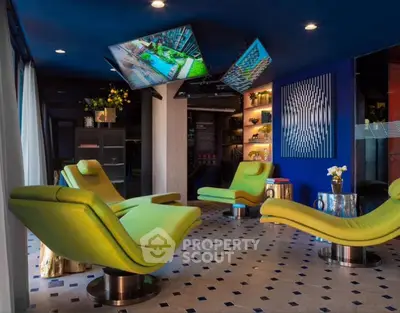 Modern lounge area with vibrant green chairs and stylish decor
