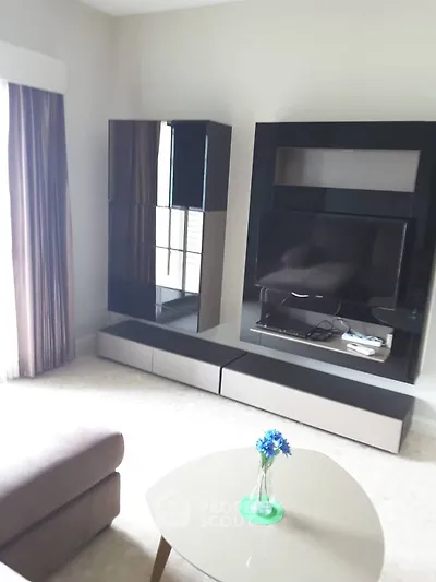 Modern living room with sleek entertainment center and cozy sofa