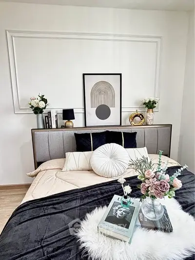 Stylish bedroom with modern decor and cozy bedding