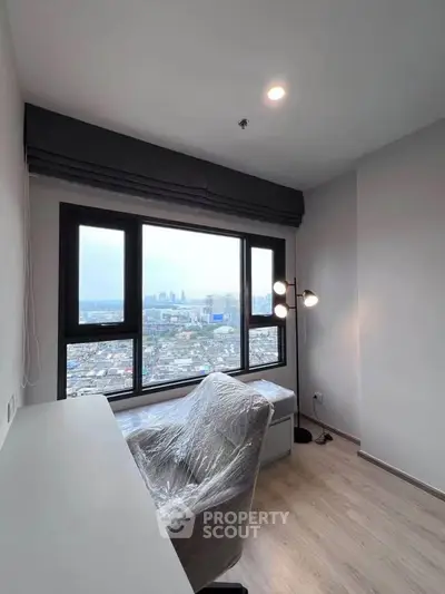 Modern study room with city view, featuring sleek desk and chair, ideal for productivity and inspiration.
