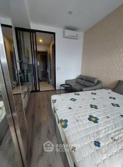 Modern bedroom with stylish decor and cozy seating area