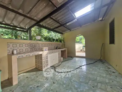 Charming outdoor kitchen with rustic tile design and open-air ambiance