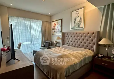 Luxurious bedroom with elegant decor and large window offering city views, perfect for urban living.