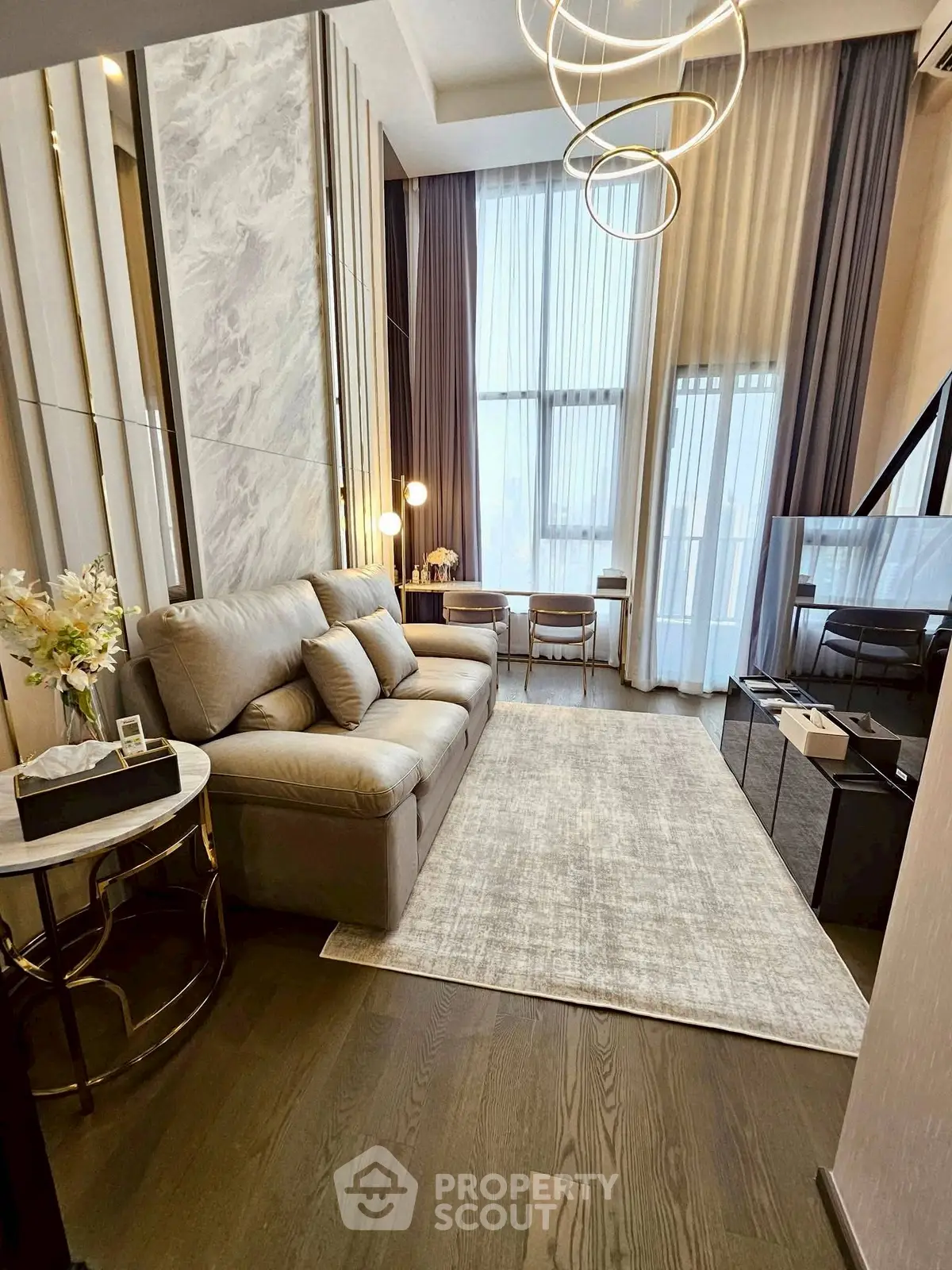 Luxurious modern living room with high ceilings and elegant decor