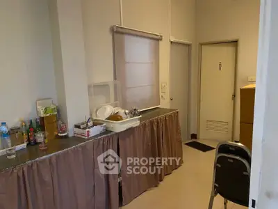 Compact kitchen area with closed layout and essential amenities