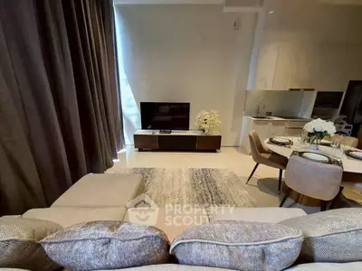 Modern living room with stylish decor and open kitchen layout